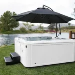 sundance spa with hot tub accessories - steps and umbrella