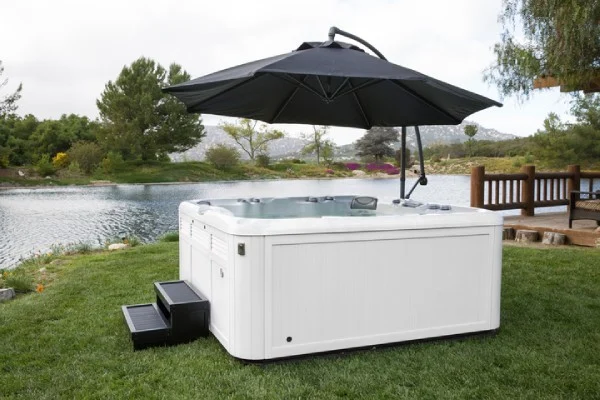 sundance spa with hot tub accessories - steps and umbrella