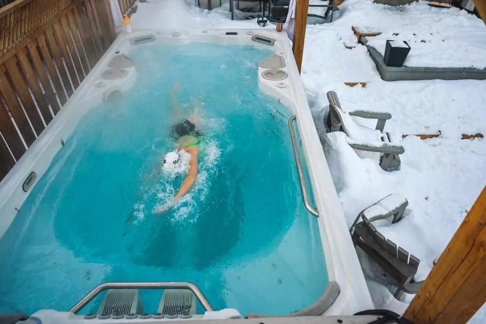 Woman Swimming In A Hydropool Outdoor Swim Spa